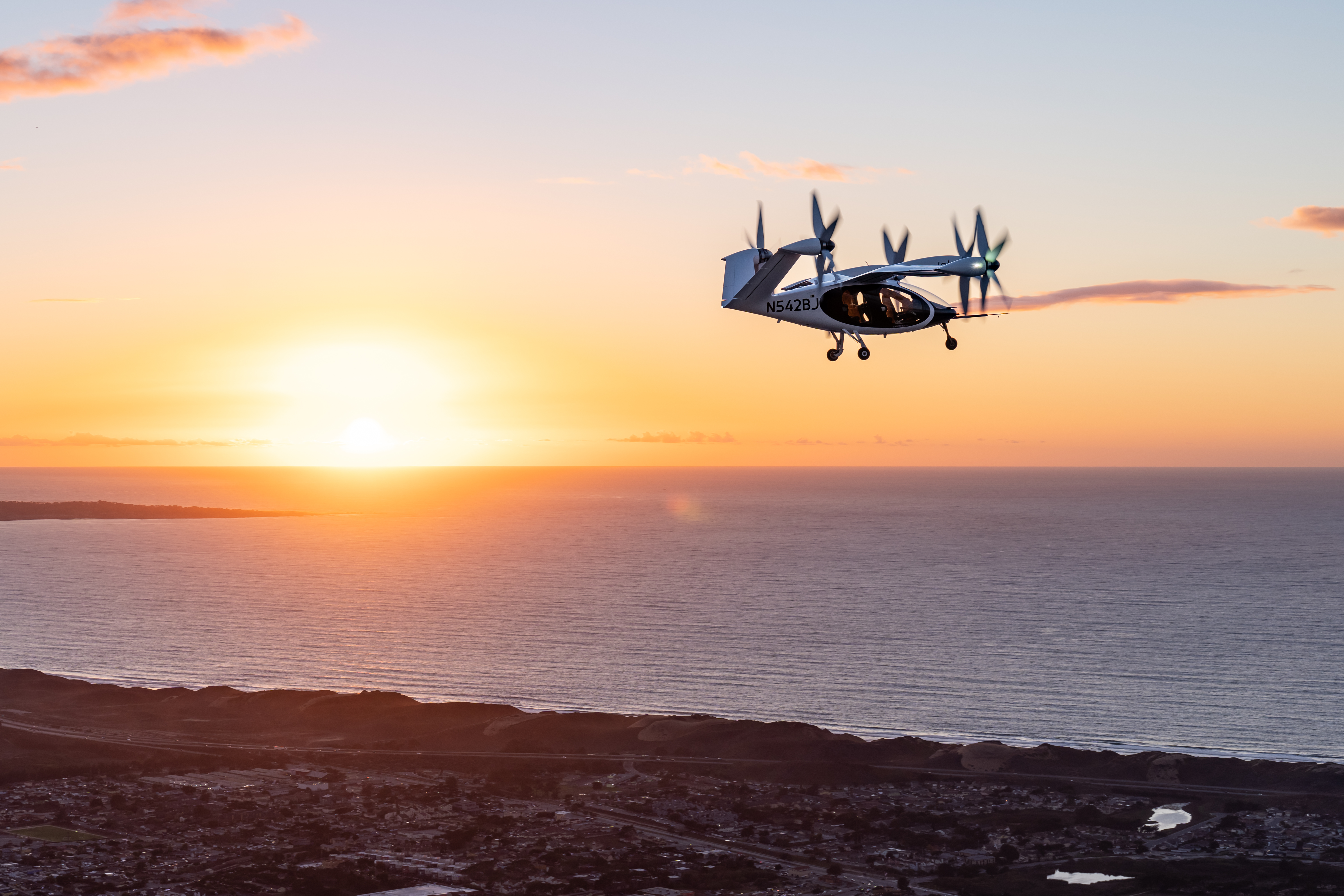 Joby's eVTOL aircraft prototype is pictured during a test flight above Marina, California, where the company has set up its pilot production facility. (Photo: Joby Aviation)