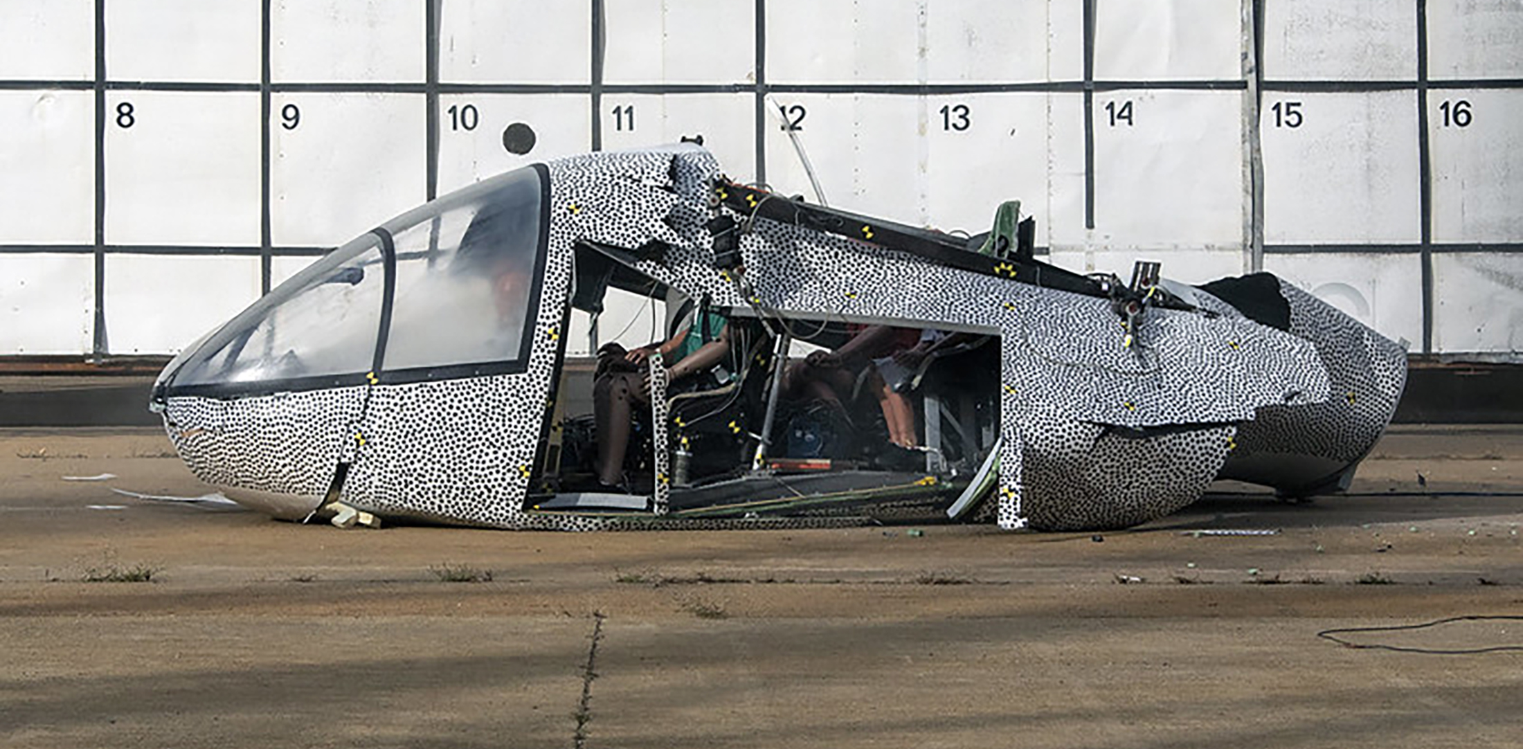 An eVTOL cabin concept lies crumpled on the ground after a crash test