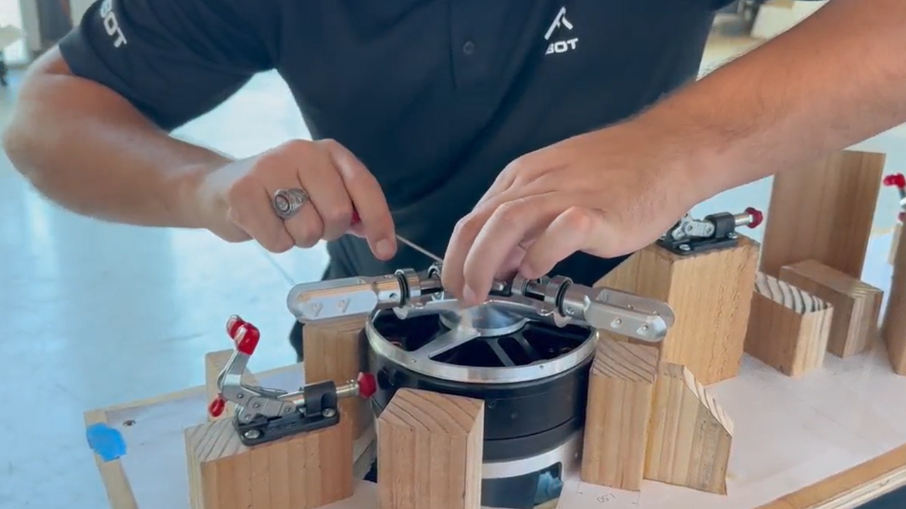 An AIBot engineer works on an eVTOL motor