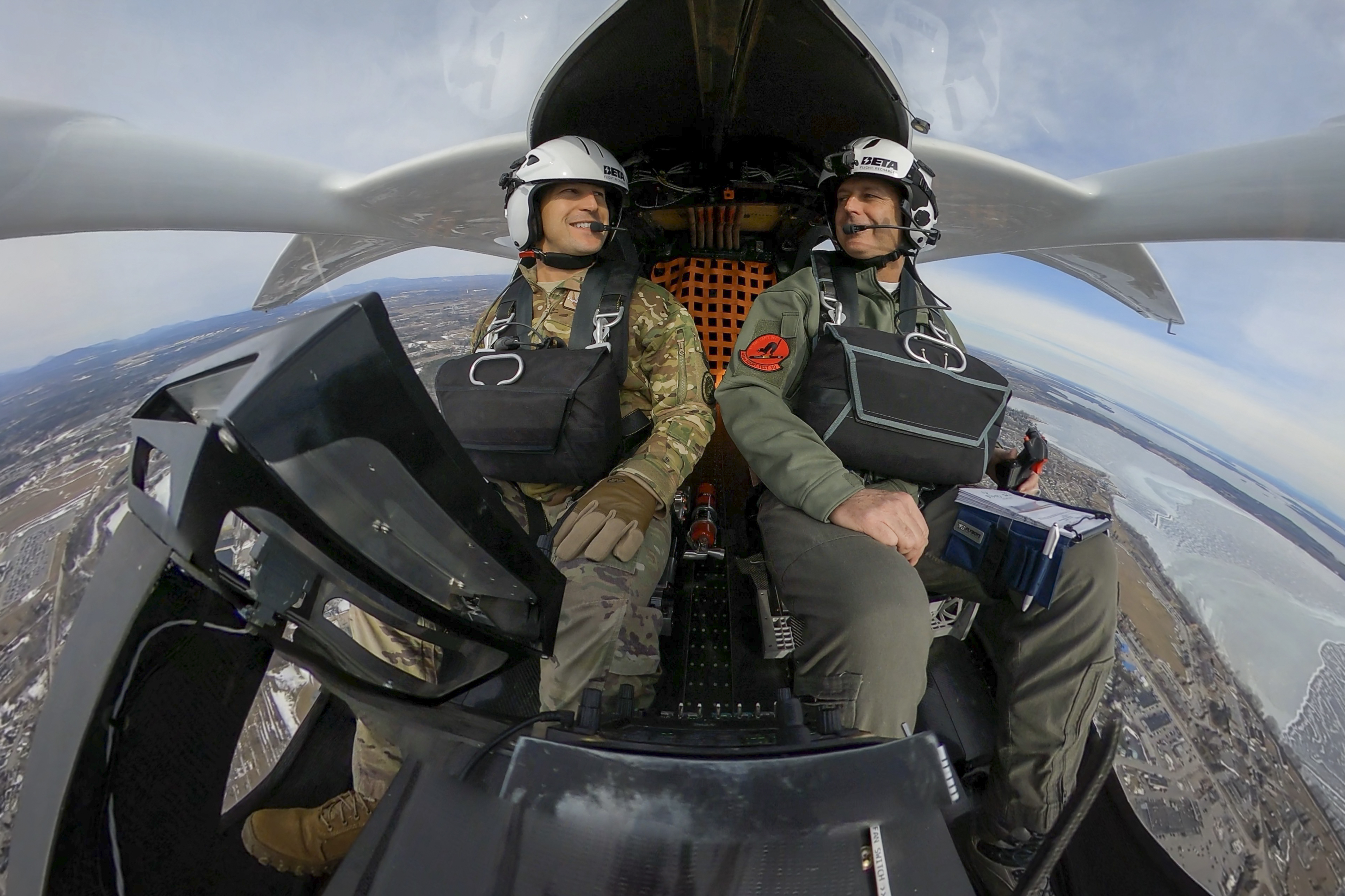 U.S. Air Force Pilots flying Beta Technologies's Alia 250 eVTOL aircraft.