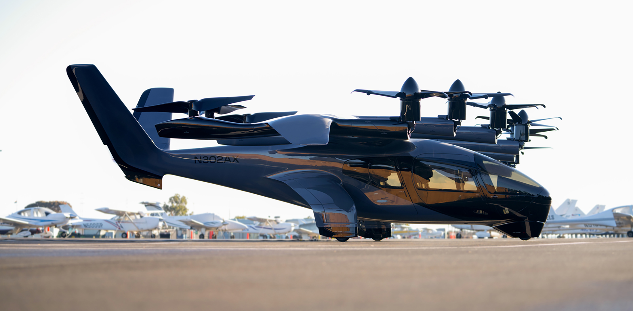 Archer's Midnight eVTOL air taxi is pictured on the tarmac at an airport.