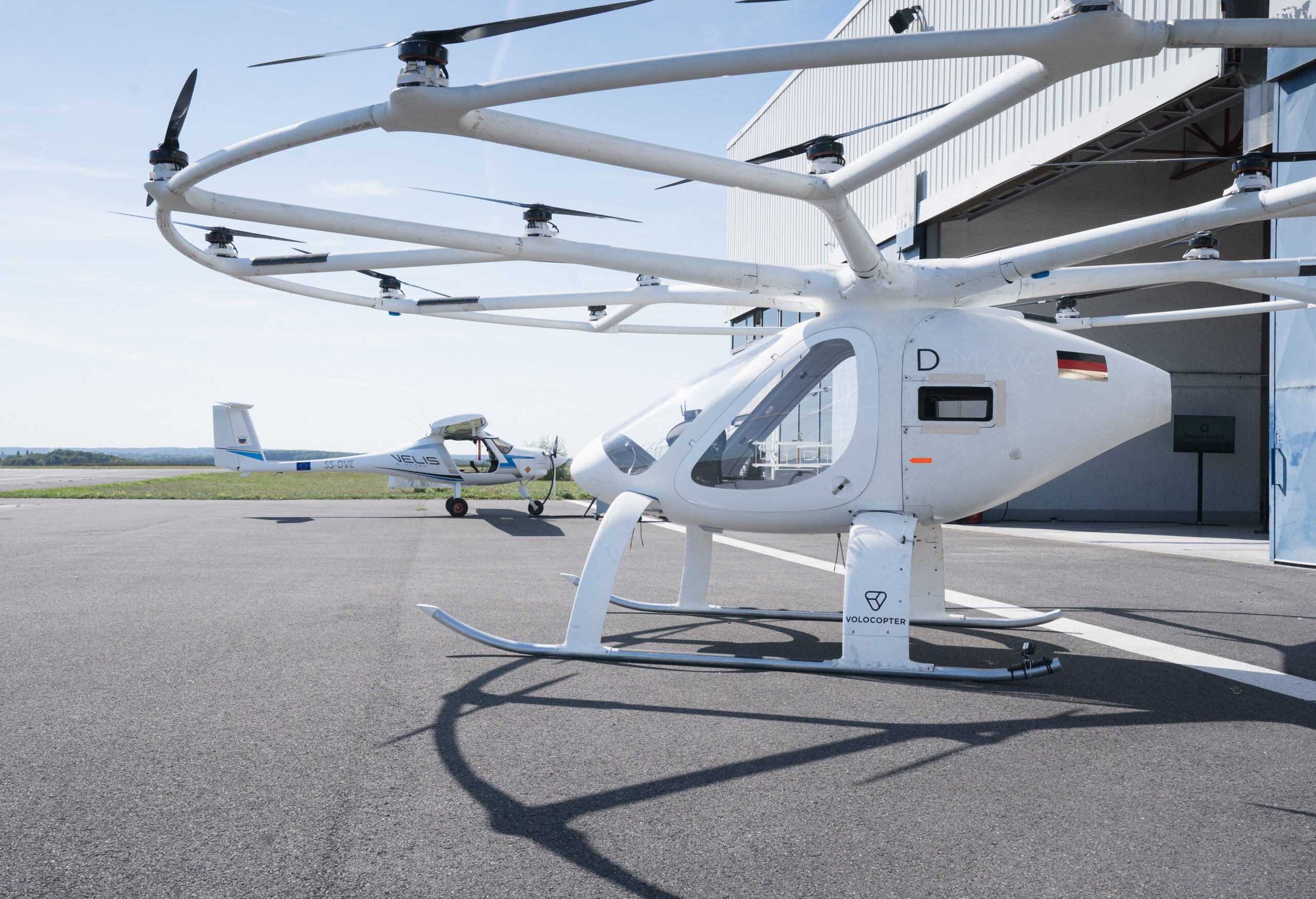 Volocopter's 2X eVTOL vehicle (foreground) and Pipistrel's Velis Electro electric light aircraft were involved in flight trials to evaluate air traffic management for crewed and uncrewed operations.