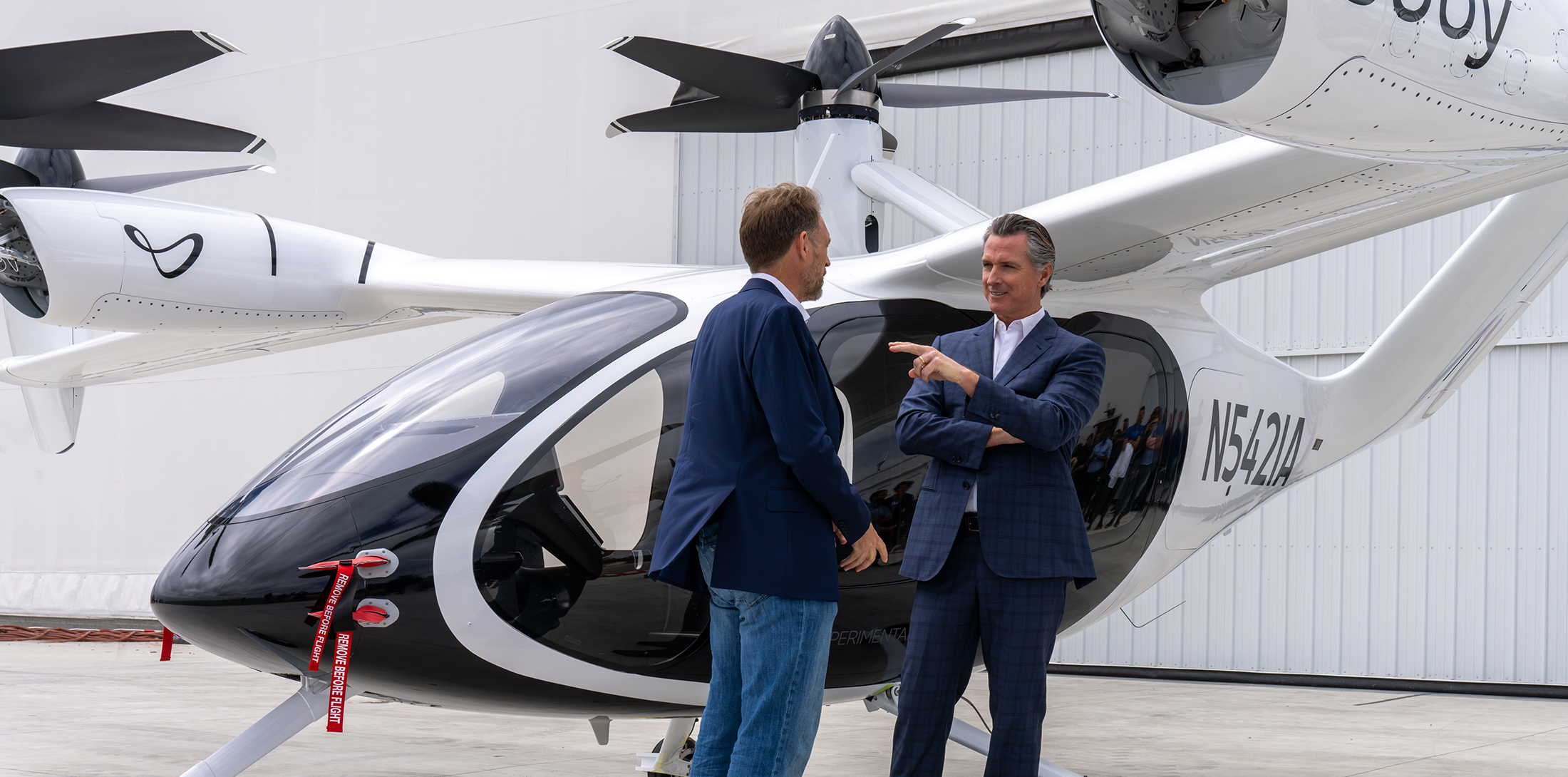 California Governor Gavin Newsom and Joby founder/CEO JoeBen Bevirt are pictured with Joby's eVTOL.