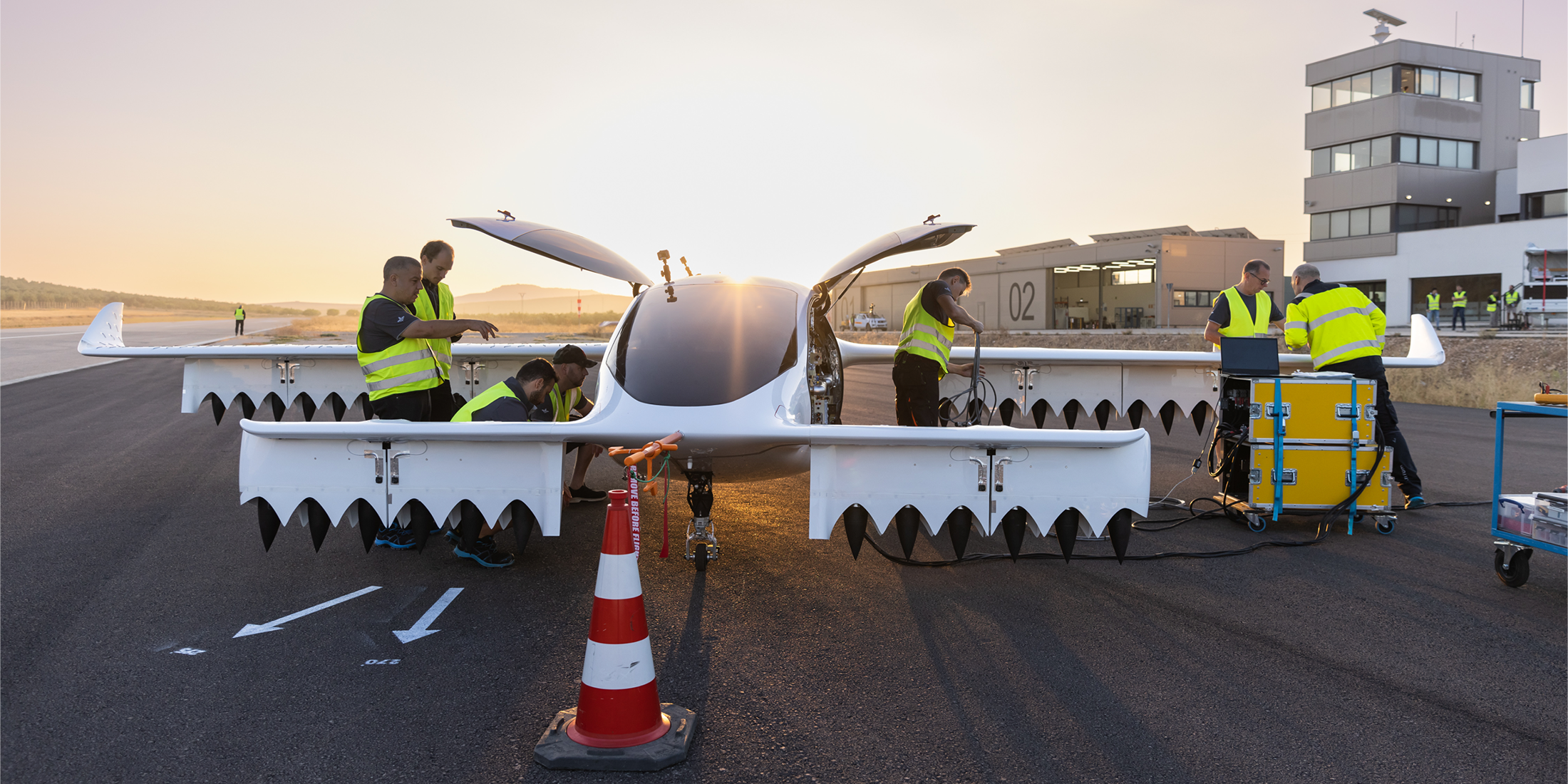 Lilium engineers inspect an eVTOL prototype on the tarmac during flight testing