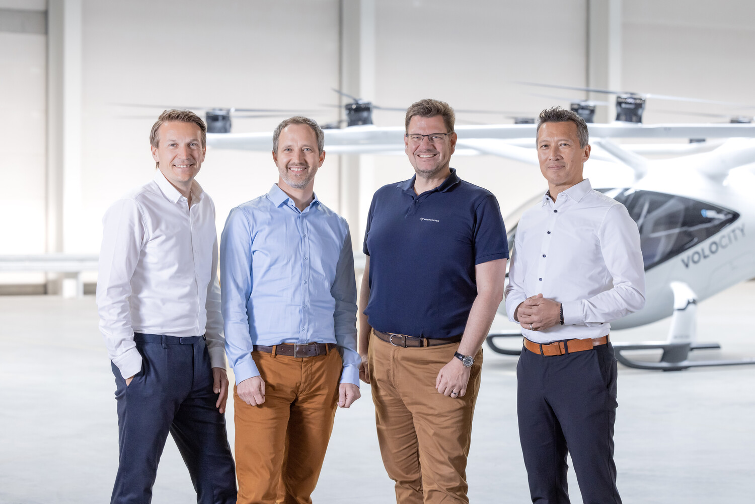Christian Bauer CCO of Volocopter, Florian Reuter CEO of Volocopter, Stefan Klocke Chairman of the Board of Volocopter, and Dirk Hoke, future CEO of Volocopter, in front of the VoloCity
