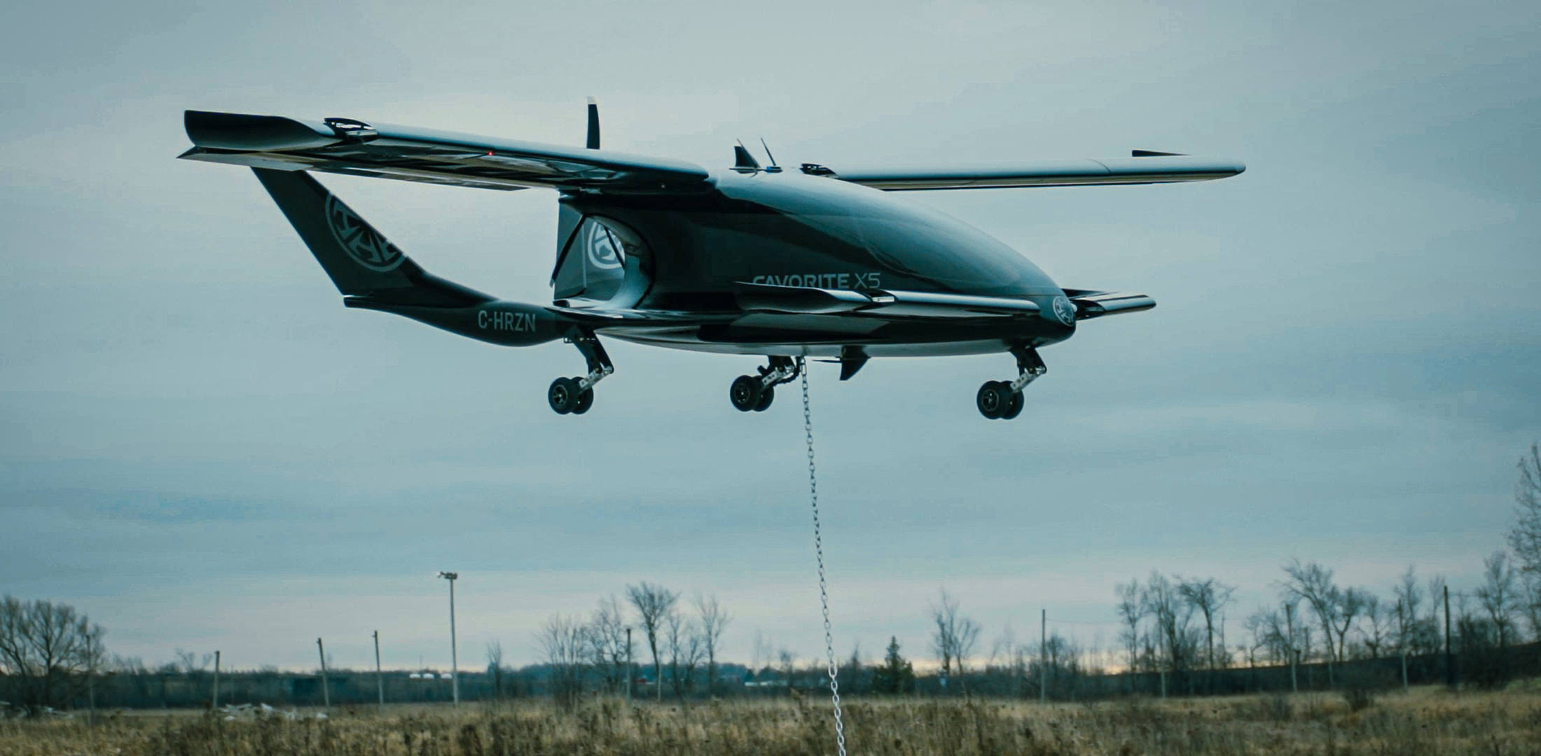 Horizon Aircraft's Cavorite X5 eVTOL aircraft prototype is pictured hovering above the ground during a hover flight test.