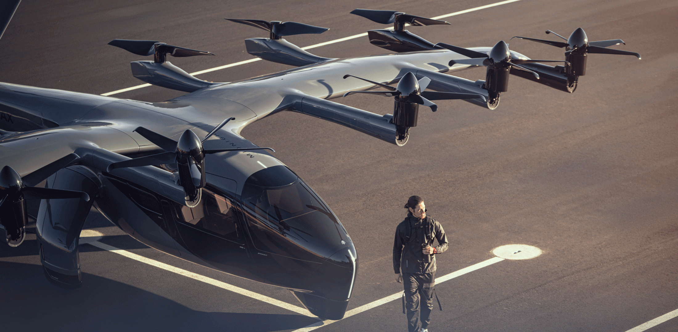 Archer's Midnight eVTOL air taxi is pictured on the tarmac at an airport.