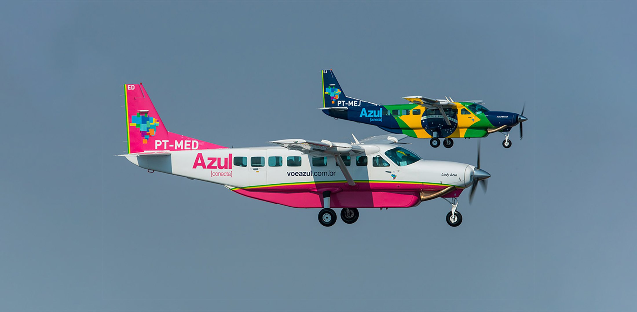 Two Azul Conecta Grand Caravans are pictured in flight.