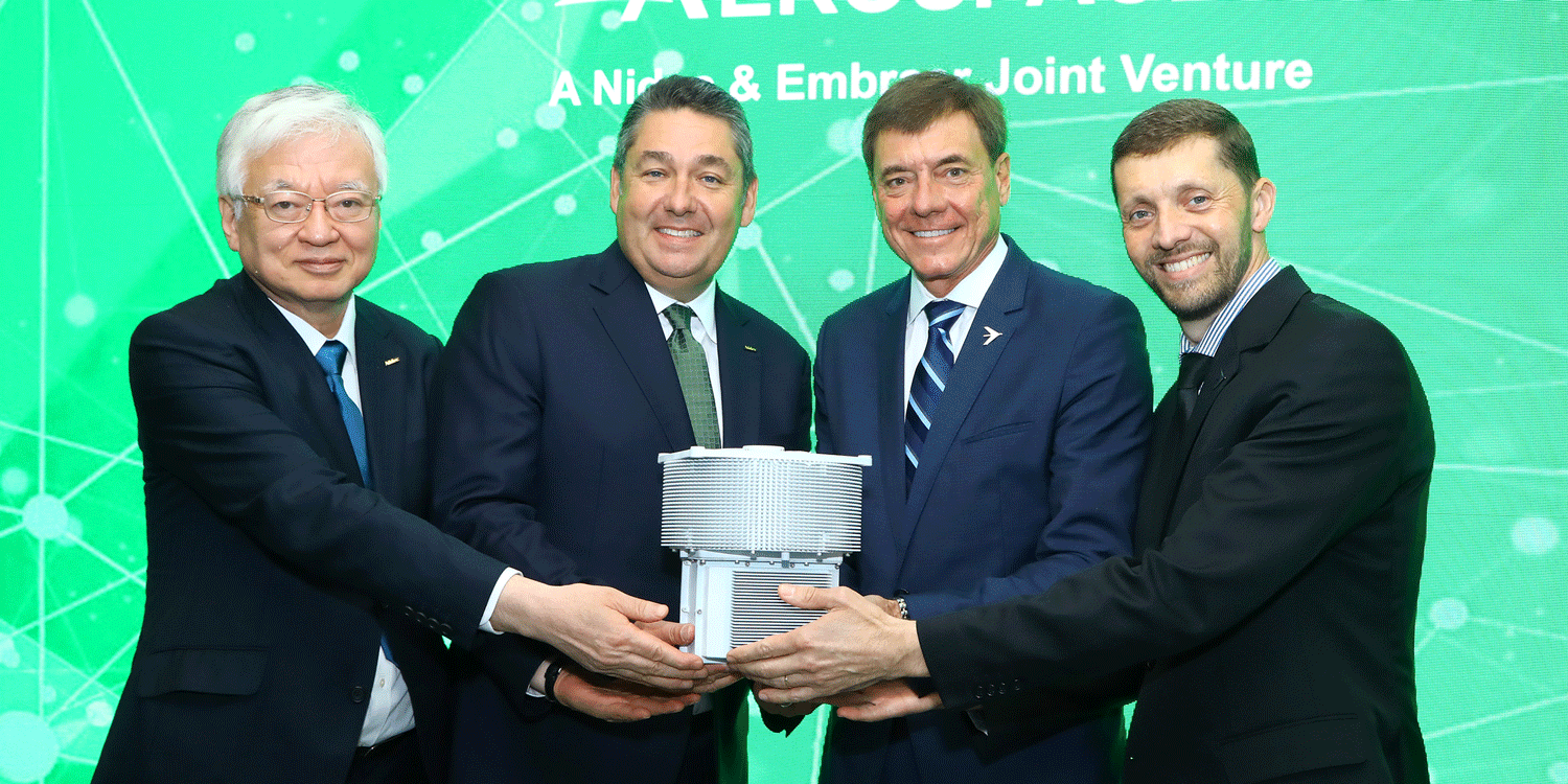 Nidec and Embraer officials show off a half-scale model of Nidec Aerospace's new electric motor during a media briefing at the Paris Airshow on June 18, 2023. Left to right: Nidec senior v-p Takamitsu Araki, Nidec president Michael Briggs, Embraer president and CEO Francisco Gomes Neto, and Embraer senior v-p of innovation and corporate strategy Dimas Douglas Tomelin.