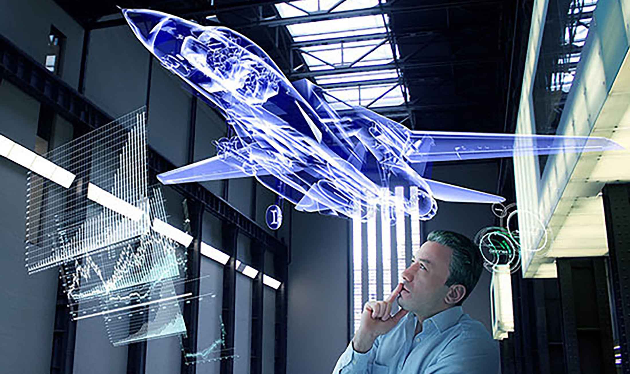 An engineer looks at a holographic diagram of an airplane