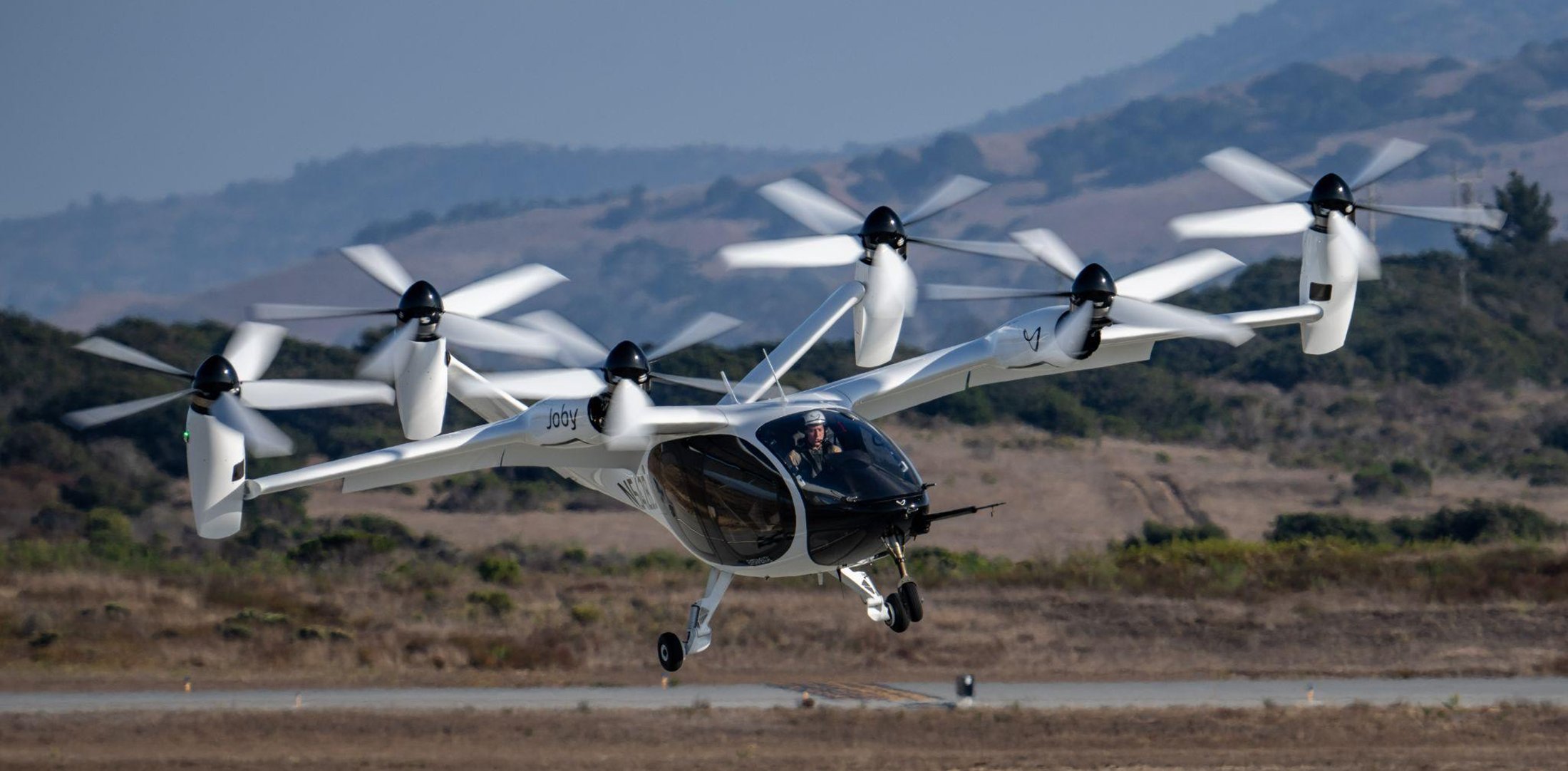 Joby experimental test pilot Zach Reeder flies the company's preproduction prototype eVTOL aircraft in Marina, California.