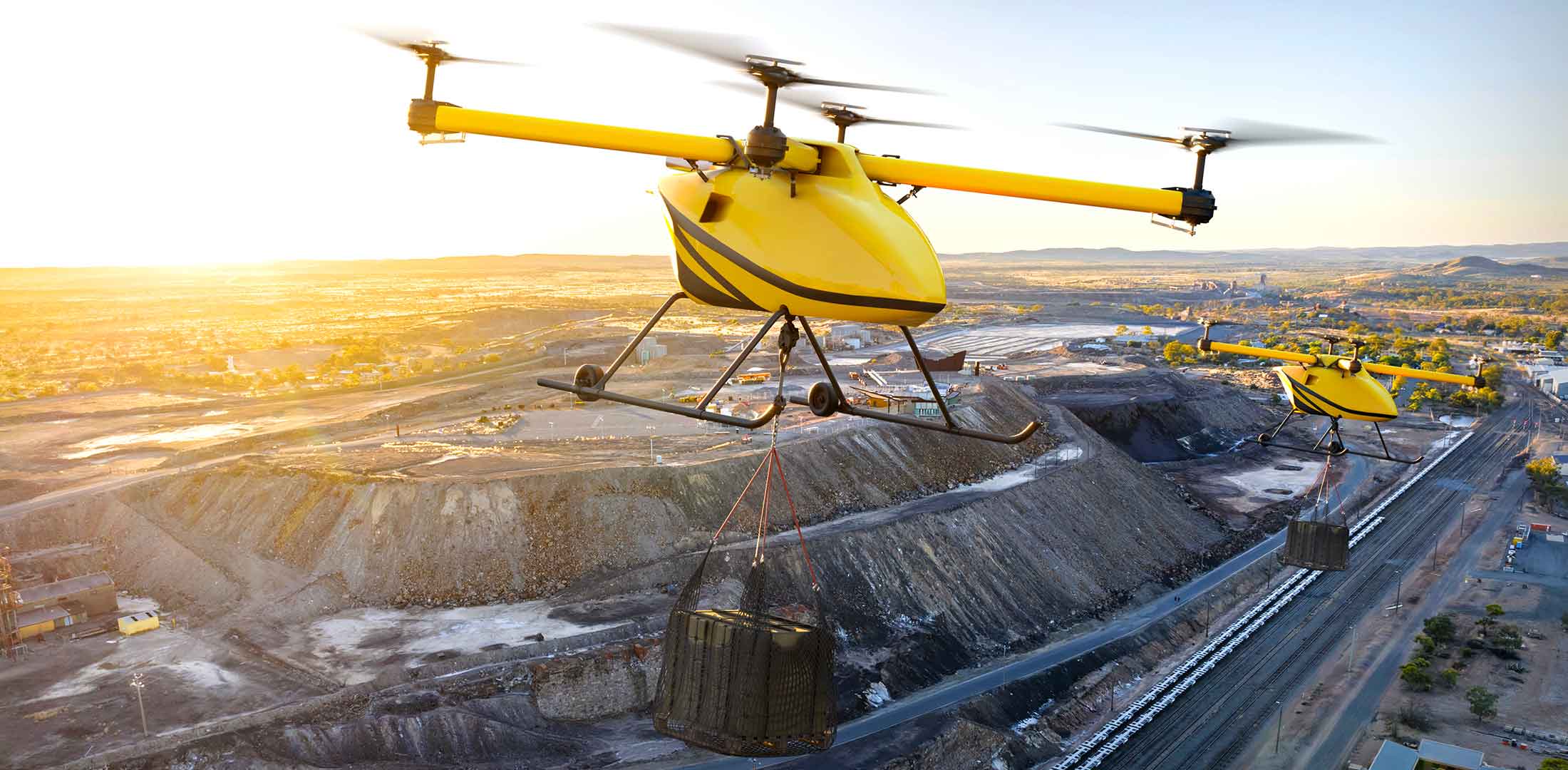 An artist's rendering of a yellow Kargo UAV flying on a mining mission