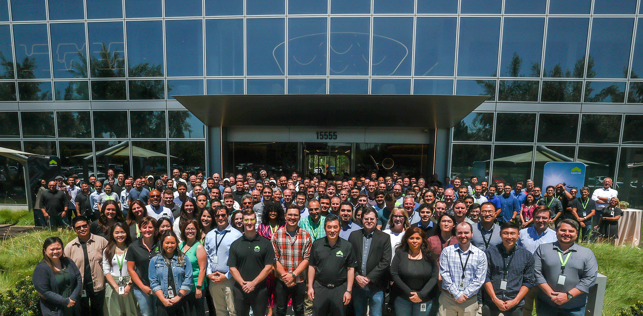 Supernal employees pose for a group photo in front of the company's new engineering headquarters in Irvine, California.