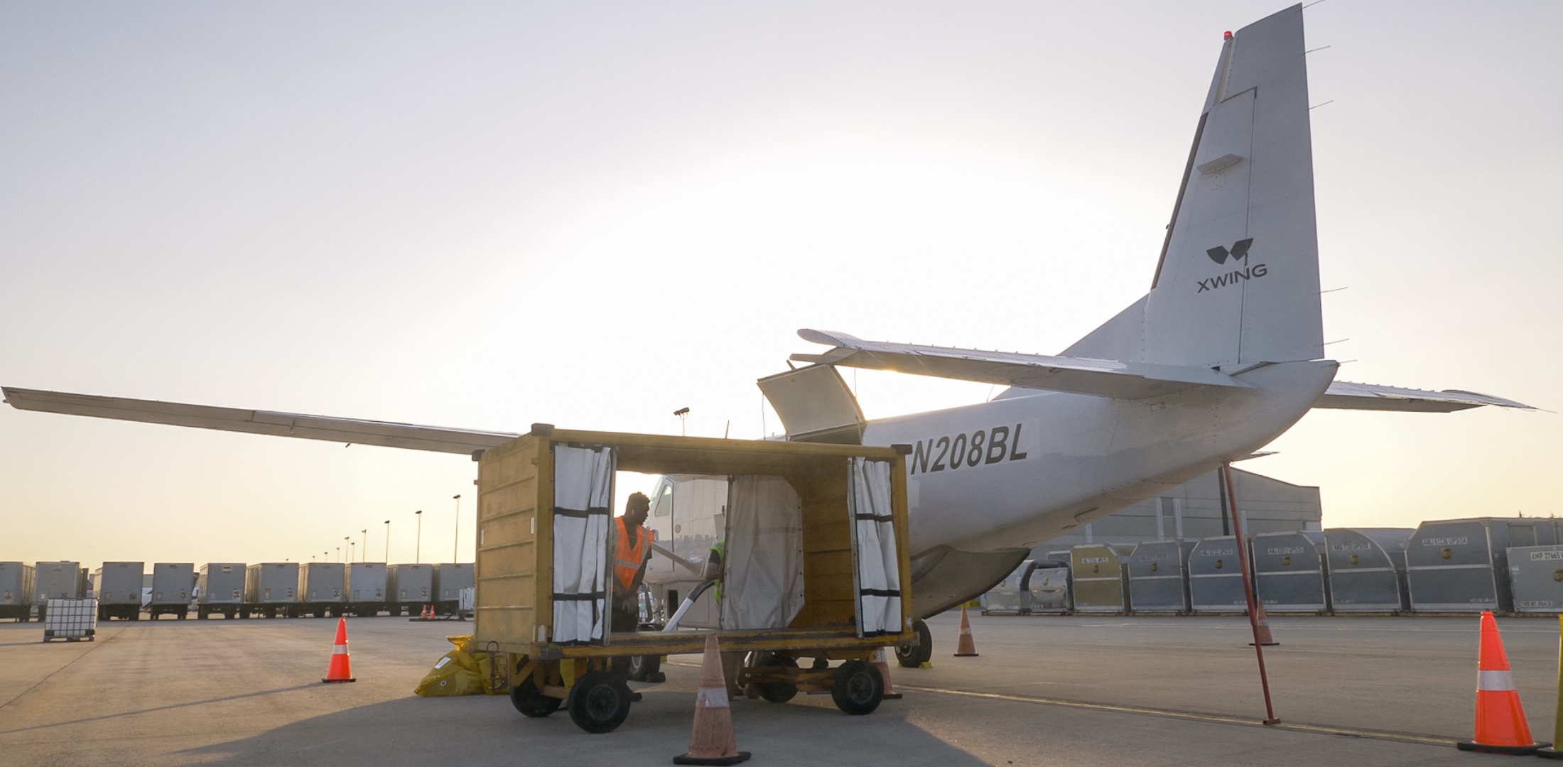 An Xwing Cessna 208B Grand Caravan aircraft is pictured on the tarmac.