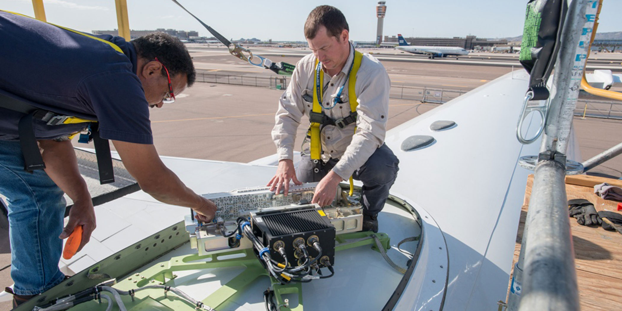Honeywell workers install JetWave hardware for GX Aviation aboard the company’s B757 flying testbed.