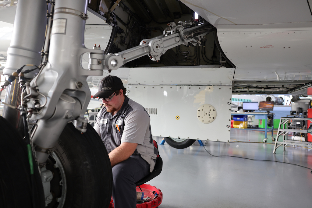 Duncan Aviation technician working on landing gear