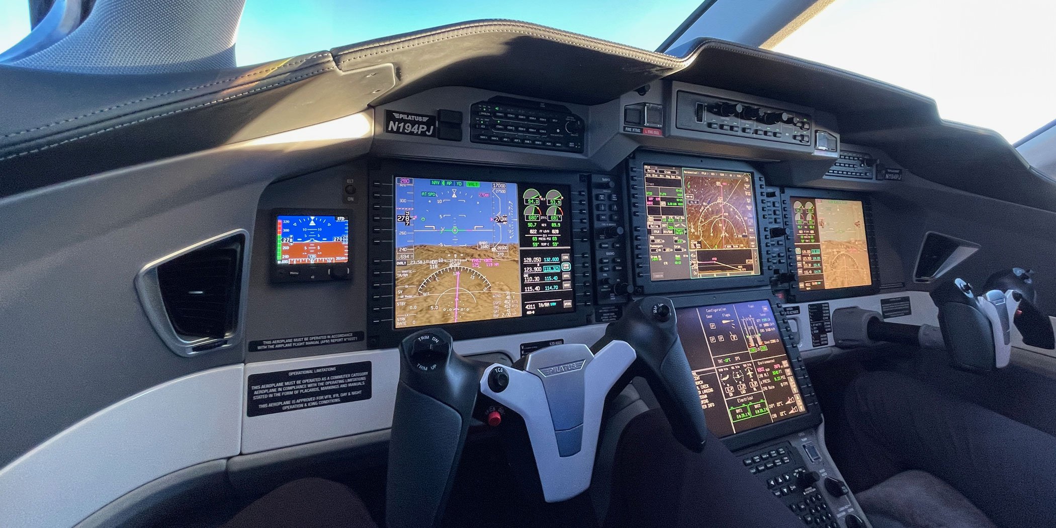 The PC-24 flight deck features a Honeywell Epic-based avionics suite, cursor-control device interface, and autothrottles.