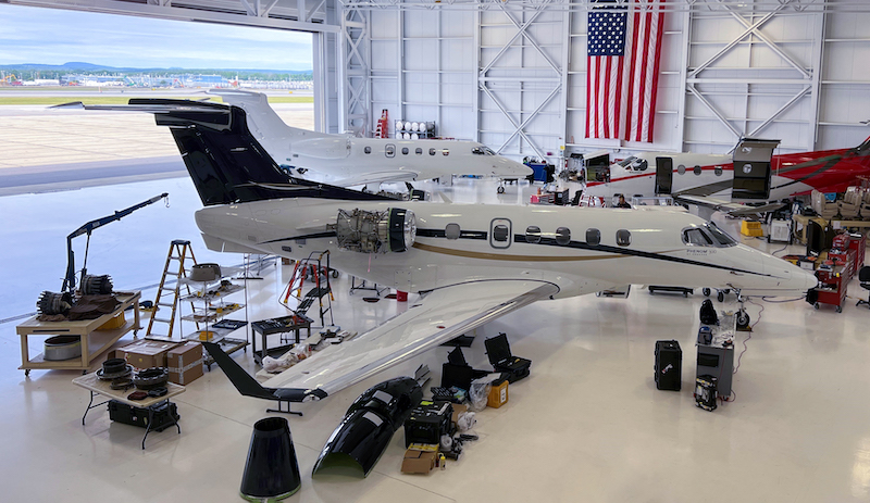 Overhead view of Embraer Phenom 300 in Pro Star Aviation hangar